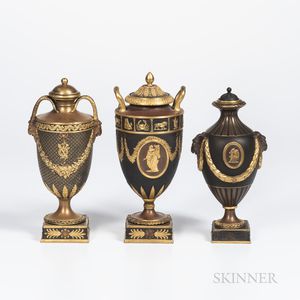 Three Wedgwood Gilded and Bronzed Black Basalt Vases with Covers