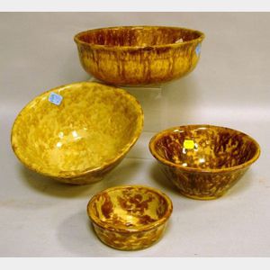 Four Assorted Rockingham Glazed Stoneware Bowls.