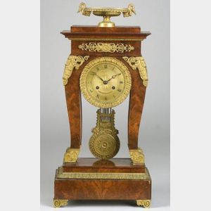 French Empire Mahogany and Ormolu Mounted Mantel Clock