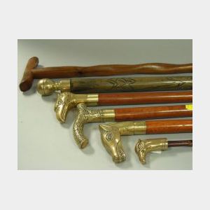 Six Wooden Walking Sticks and Canes with Brass Handles.