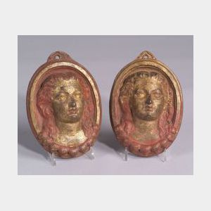 Pair of Red Painted and Gilt Cast Iron Oval Portrait Plaques