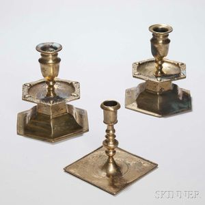 Pair of Continental Hexagonal Mid-drip Brass Candlesticks and a Single Square-base Candlestick