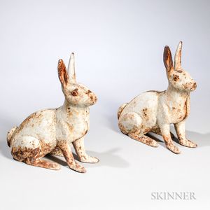 Two White-painted Cast Iron Rabbits
