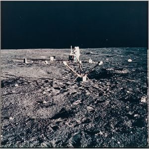 Apollo 12, Astronaut Charles Conrad Jr. Aligns the Antenna on the Central Station of the Apollo Lunar Surface Experiments Package...