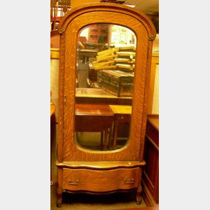 Early 20th Century Carved Oak Mirrored Wardrobe over Long Drawer.