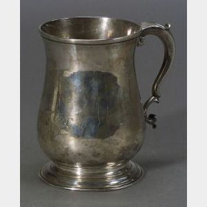 George II Silver Mug. balustroid, with scroll handle topped by leaftip, on spreading foot, monogrammed, ht. 5 in., approx. 10 troy oz.