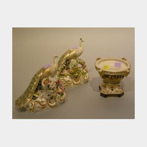 Pair of Derby Hand-Painted Porcelain Peacock Figures and Gilt Decorated Urn.