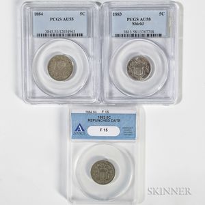 1882 and 1883 Shield Nickels and an 1884 Liberty Head Nickel