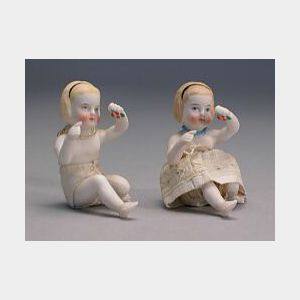 Two Molded Seated Parian Girls Holding Cherries