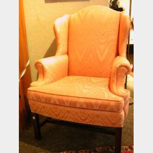 Chippendale-style Upholstered Mahogany Wing Chair.