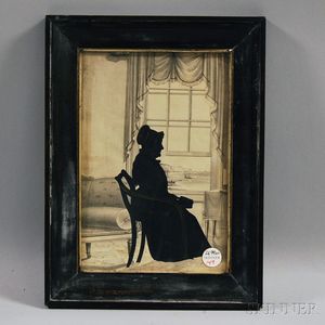 Framed Silhouette Portrait of a Woman at a Window