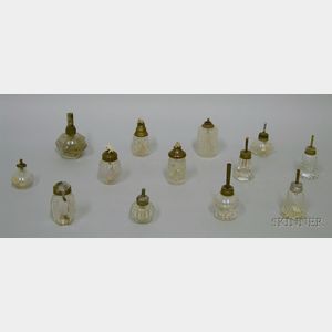 Thirteen Assorted Small Blown and Pressed Glass Lamps, in colorless glass with camphene and whale oil burners, one with ribbed and cut