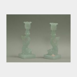 Pair of Sandwich Pressed Clambroth Glass Dolphin Candlesticks.