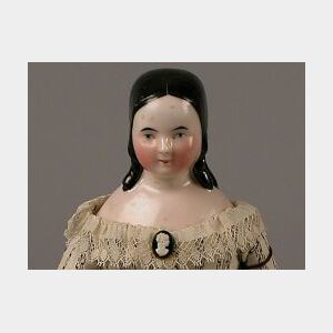 Small Pink-Toned China Doll with Long Molded Curls