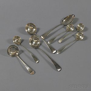 Eight English Sterling Silver Serving Spoons