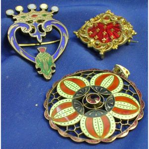Two Silver and Enamel Pins and a Sterling and Enamel Pendant.