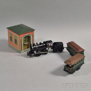 Small Group of Toy Trains and a Tin Bank
