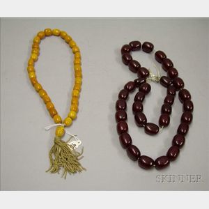 Two Strings of Amber Beads.