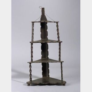 Carved and Painted Wood Four-Tier Corner Shelf.