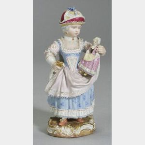 Meissen Figurine of a Girl Holding a Doll