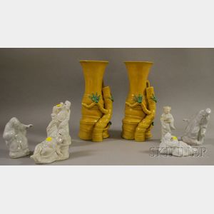 Set of Six Chinese White Glazed Molded Porcelain Figures and a Pair of Glazed Porcelain Bamboo-form Vases