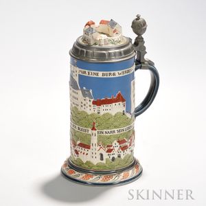 Mettlach Stoneware Stein, Germany, 20th century, the decorated with a polychrome, low-relief cityscape, ht. 10 1/2, dia. 5 1/4 in.