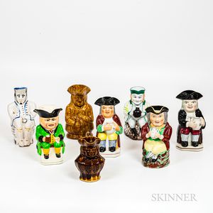 Eight Staffordshire Toby Jugs