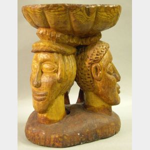 Ethnographic Wooden Stool Carved with Three Faces.