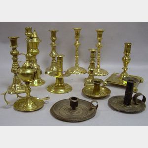 Thirteen Assorted Brass and Tin Candlesticks and Lamps.