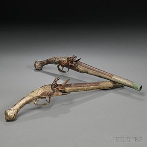 Two Middle Eastern Brass Flintlock Pistols
