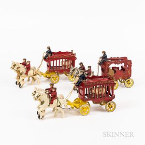 Three Polychrome-painted Cast Iron Bear and Calliope Wagons Complete