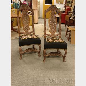 Pair of Continental Baroque-style Needlepoint Upholstered Carved Walnut Hall Chairs.