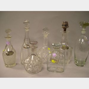 Seven Colorless Molded and Cut Glass Decanters.