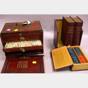Leather Bound Book-form Poker Chip Box and an Asian Brass Bound Hardwood Cased Ivory Mahjongg Set.