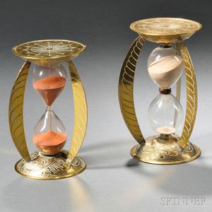 Near Pair of Brass and Glass Hourglasses