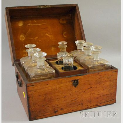 Walnut Spirit Chest with a Partial Set of Seven Gilt-decorated Colorless Blown Glass Decanters and a Pair of Glasses