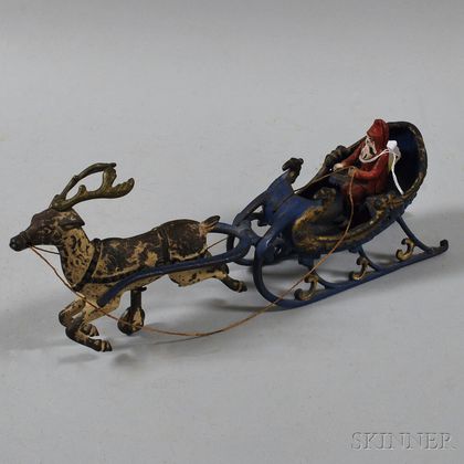 Vintage Polychrome-painted Cast Iron Santa Claus and Reindeer Toy