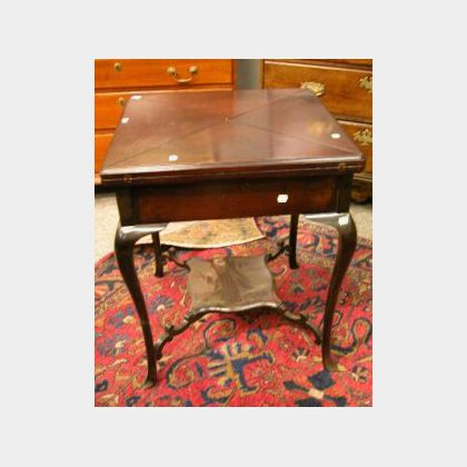 Late Victorian Mahogany Folding-top Games Table. 