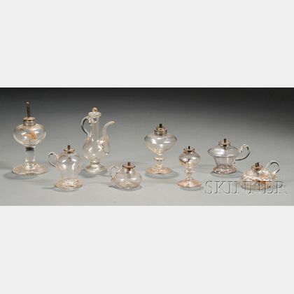 Eight Colorless Free-blown Glass Lamp Items