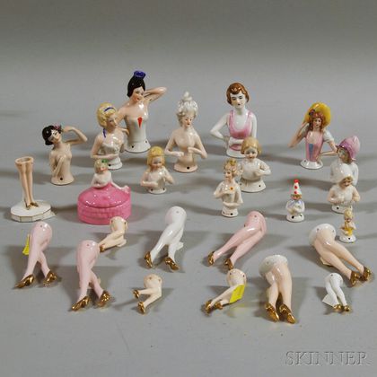 Twenty-four Porcelain Half Dolls and a Figural Box