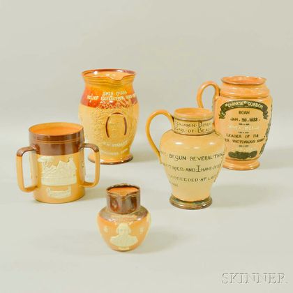 Four Royal Doulton and Doulton Lambeth Stoneware Commemorative Jugs and a Loving Cup