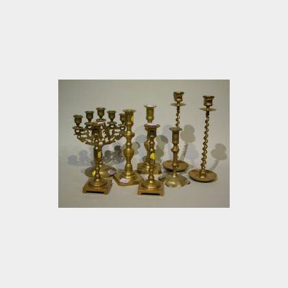 Eight Brass Candlesticks and a Candelabra