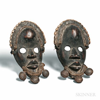 Pair of Dan-style Carved Wood and Shell Gunyeya Masks