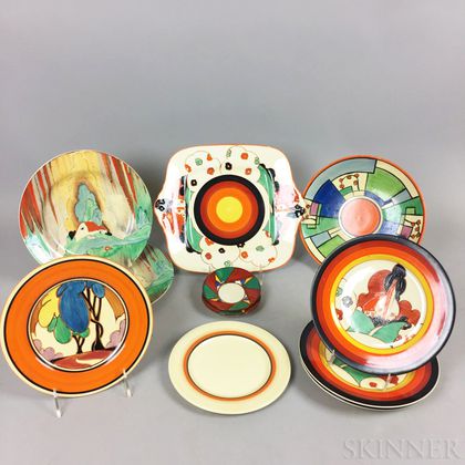 Twelve Clarice Cliff-decorated Newport Pottery Plates and Dishes
