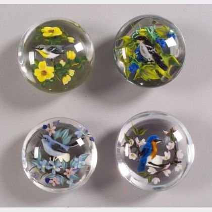 Four Rick Ayotte Glass Paperweights