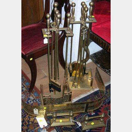 Pair of Brass Fire Tool Stands with Four Tools, a Brass Fireplace Fender, and a Pair of Tool Rests. 