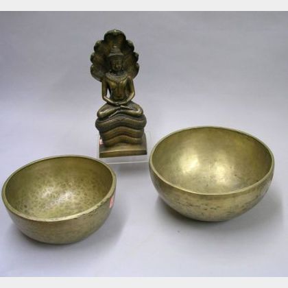 Two Asian Hammered Brass Singing Bowls and a Bronze Figure of Deity. 
