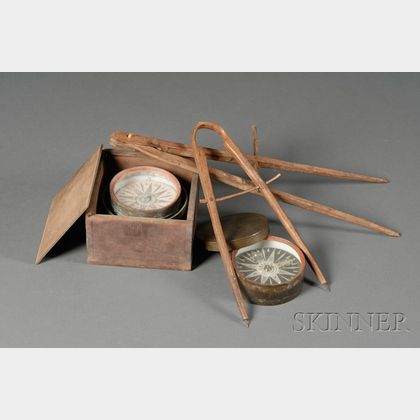 Two Boxed Compasses and Two Carved Wooden Compasses