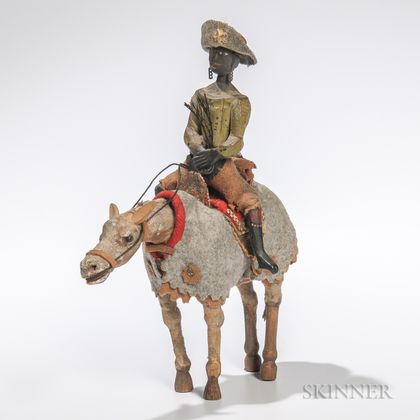 Carved and Painted Articulated Figure of a Black Man on a Horse