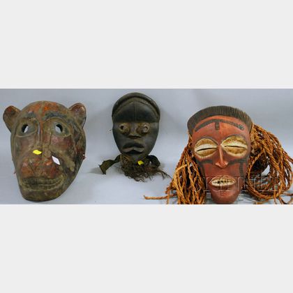 Two African-style Masks and One Himalayan Mask. 